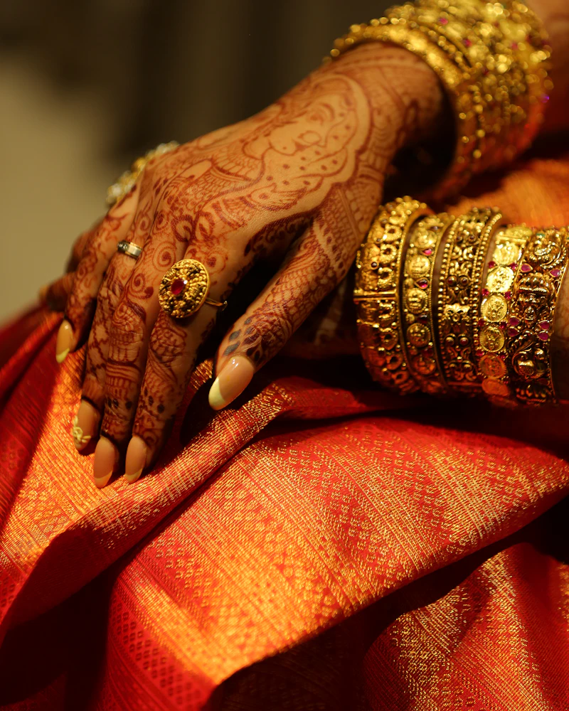 Bride's hands with alta and bangles, Odia wedding detail, Finenticee client