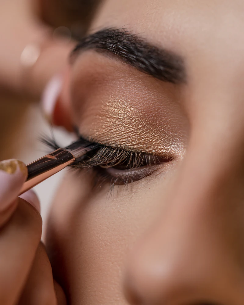 Student practising makeup on a live model at Finenticee