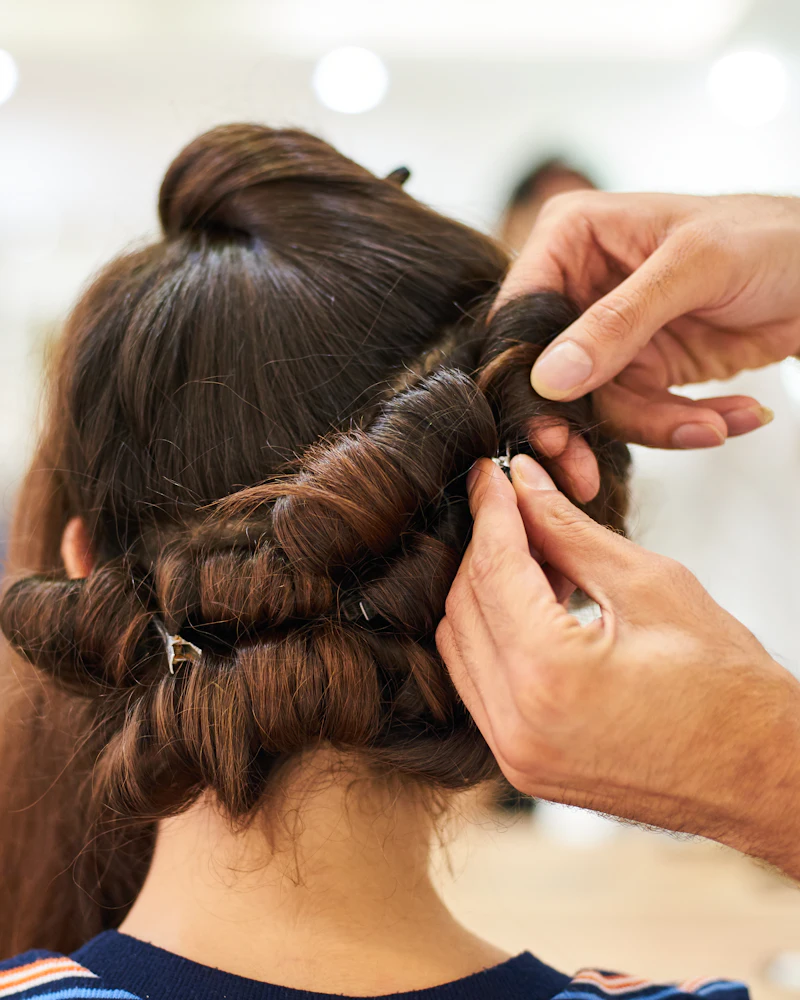 Neat French braid done by a student during practice, Finenticee hair styling class